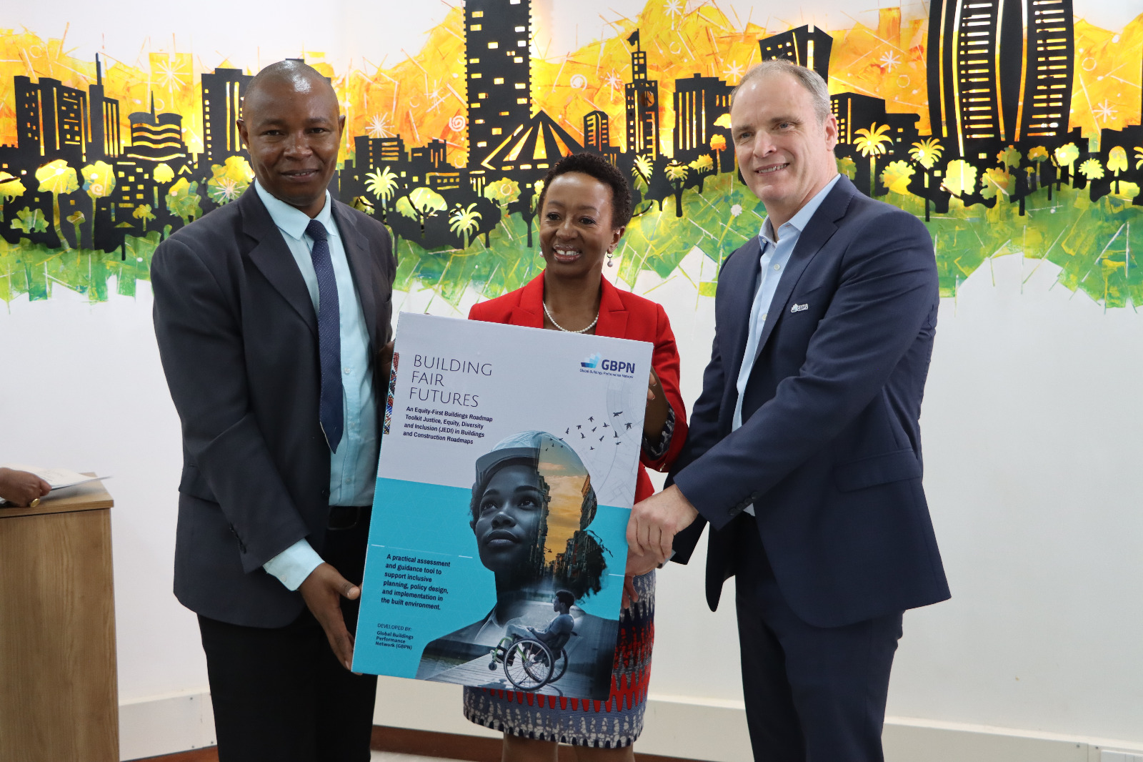 From left to right: Kennedy Matheka, State Department for Public Works Eva Murray, CEO BSD Group Dr. Peter Graham, CEO Global Buildings Performance Network(GBPN)  Holding up the physical version of the Toolkit