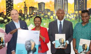 From left to right: Dr. Peter Graham, CEO Global Buildings Performance Network(GBPN) Eva Muraya, CEO BSD Group Kennedy Matheka, State Department for Public Works Rosa Kihara- Gender Expert Consultant for GBPN   Holding up the physical version of the Toolkit